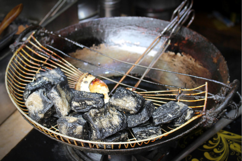 Taste stinky tofu in Kun Ming